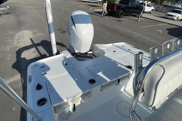 Slide: The Image of 2021 Sea Hunt BX 22 BR boat with outboard motor in a parking lot. - 12