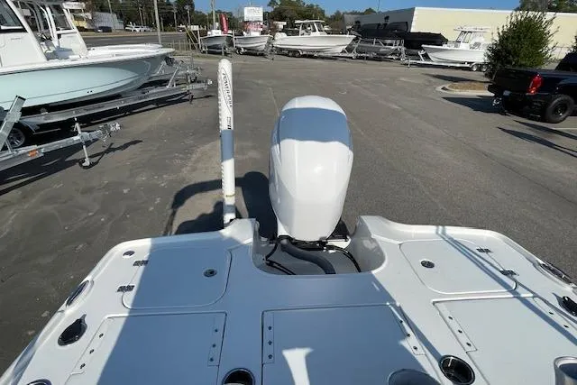 Slide: The Image of 2021 Sea Hunt BX 22 BR boat with outboard motor in a marina setting. - 14
