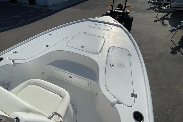 Slide: The Image of 2021 Sea Hunt BX 22 BR boat deck with storage compartments and seating. - 17