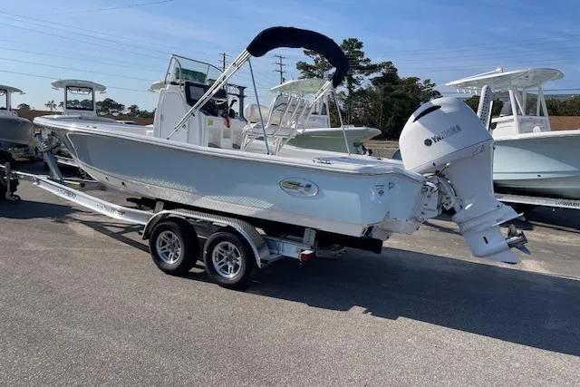 Slide: The Image of 2021 Sea Hunt BX 22 BR boat on trailer with Yamaha outboard motor. - 2