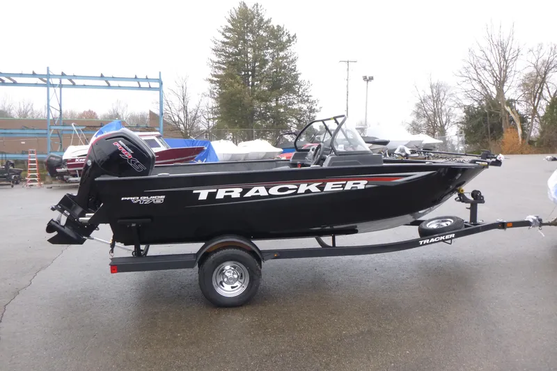 The Image of 2026 Tracker Pro Guide V-175 WT boat on trailer, parked outdoors. - 1
