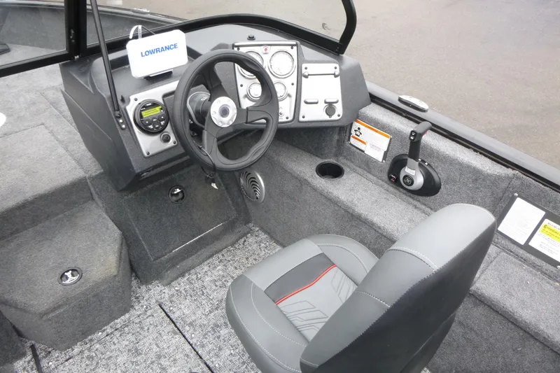 Slide: The Image of 2026 Tracker Pro Guide V-175 WT boat interior with steering wheel and control panel. - 13