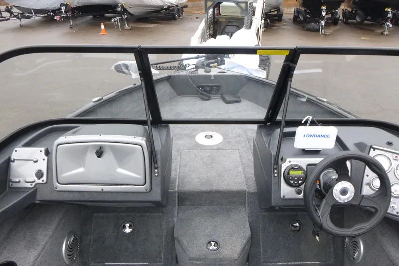 Slide: The Image of 2026 Tracker Pro Guide V-175 WT boat interior with steering wheel and Lowrance electronics. - 19