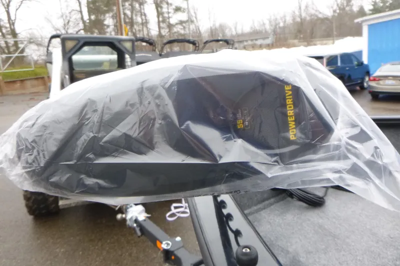Slide: The Image of 2026 Tracker Pro Guide V-175 WT boat with PowerDrive motor, covered in plastic. - 26