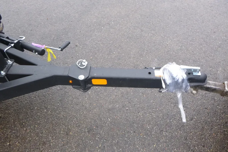 Slide: The Image of Trailer hitch of 2026 Tracker Pro Guide V-175 WT on asphalt surface. - 3