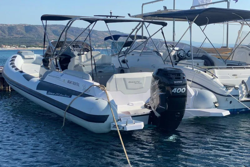 Slide: The Image of 2022 Ranieri CAYMAN 27.0 SPORT TOURING boat docked with Mercury 400 engine. - 23