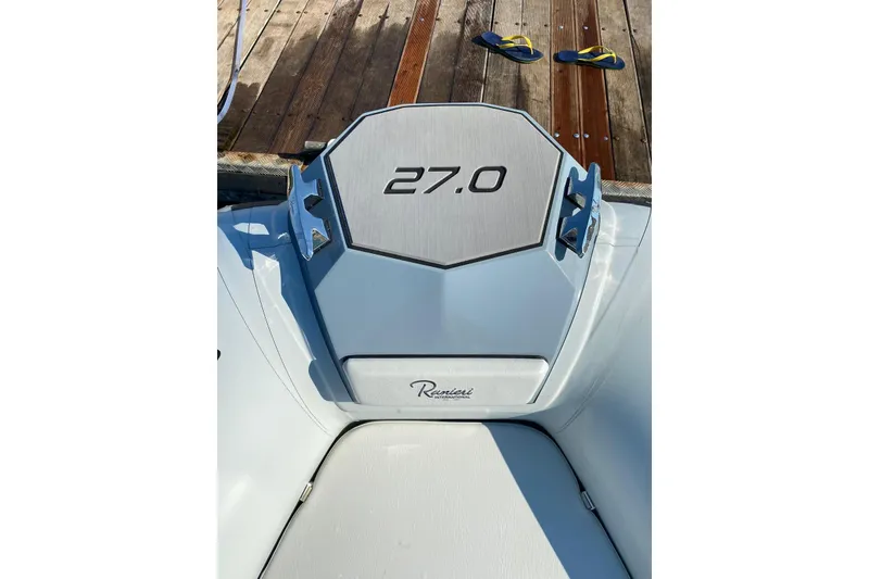 Slide: The Image of 2022 Ranieri CAYMAN 27.0 SPORT TOURING boat detail on dock with flip-flops. - 6