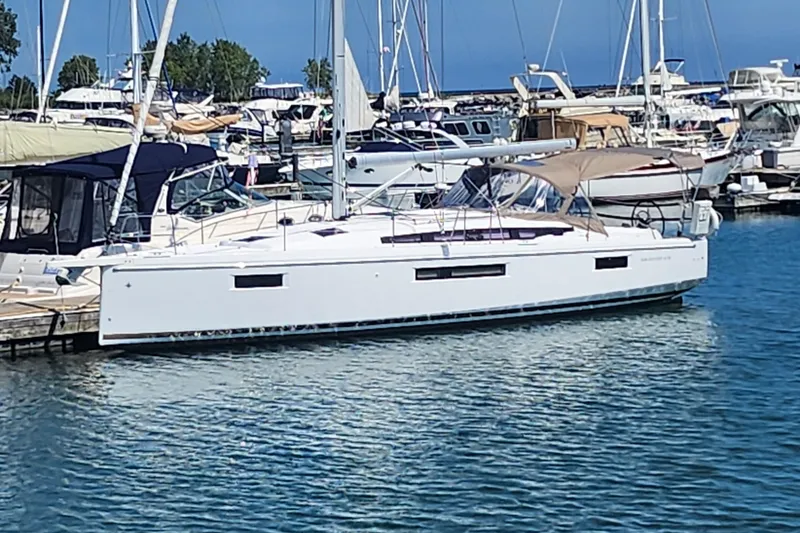 The Image of 2020 Jeanneau Sun Odyssey 410 sailboat docked in a marina. - 0