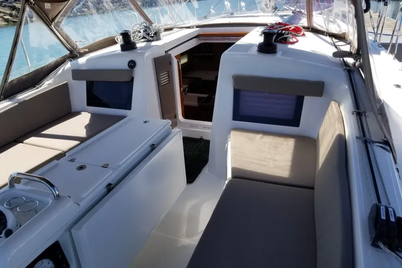 Slide: The Image of Interior view of 2020 Jeanneau Sun Odyssey 410 sailboat cockpit with seating and controls. - 12