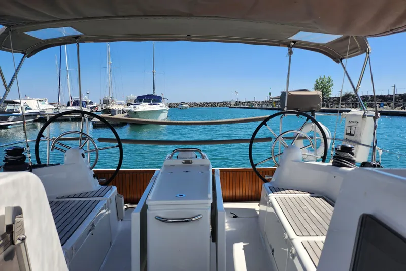 Slide: The Image of Jeanneau Sun Odyssey 410 sailboat cockpit view in marina, 2020 model. - 18