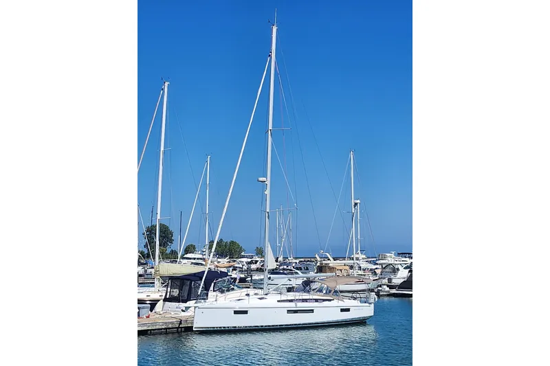 Slide: The Image of Interior of 2020 Jeanneau Sun Odyssey 410 sailboat with wooden finish and modern kitchen. - 24