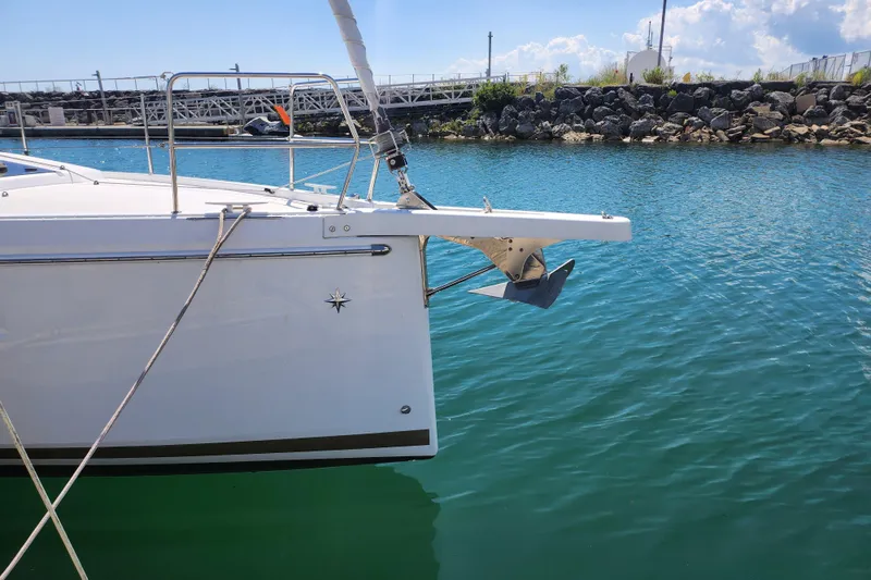 Slide: The Image of Jeanneau Sun Odyssey 410 sailboat, 2020 model, docked in a marina with clear blue water. - 3