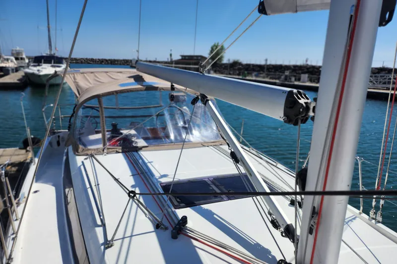 Slide: The Image of Cozy cabin interior of 2020 Jeanneau Sun Odyssey 410 with bed and compact bathroom. - 30