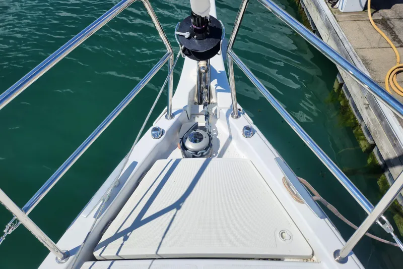 Slide: The Image of Bow of 2020 Jeanneau Sun Odyssey 410 sailboat with anchor and railing. - 4