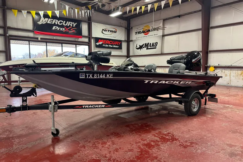 The Image of 2021 Bass Tracker Pro Team 175 boat in showroom, featuring Mercury engine. - 1
