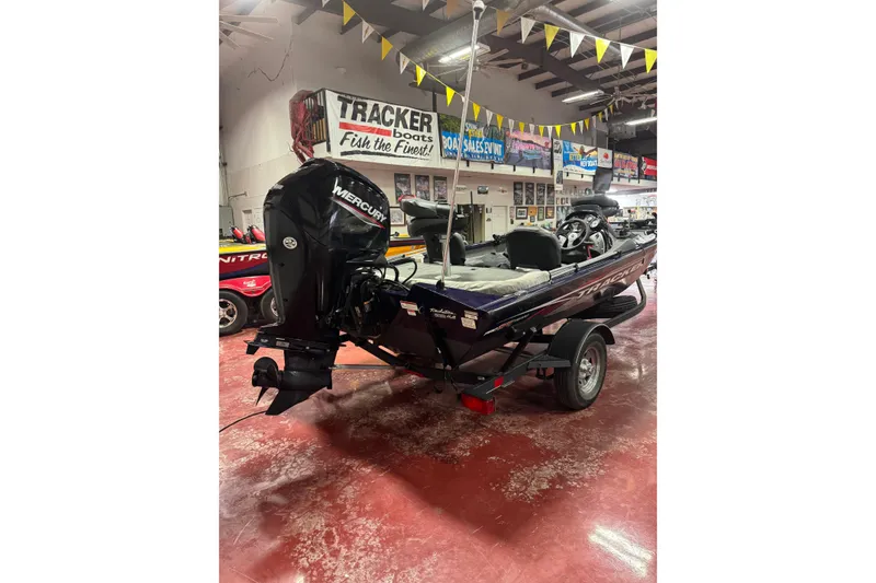 Slide: The Image of 2021 Bass Tracker Pro Team 175 boat with Mercury engine in showroom. - 4