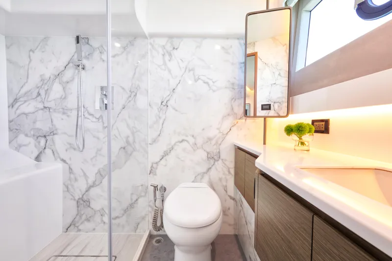 Slide: The Image of Luxurious bathroom in 2025 Skywalker S60 yacht with marble walls and modern fixtures. - 18