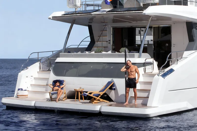 Slide: The Image of Luxury Oceanwalker S60e yacht with sunbathing and showering on deck, 2026 model. - 4