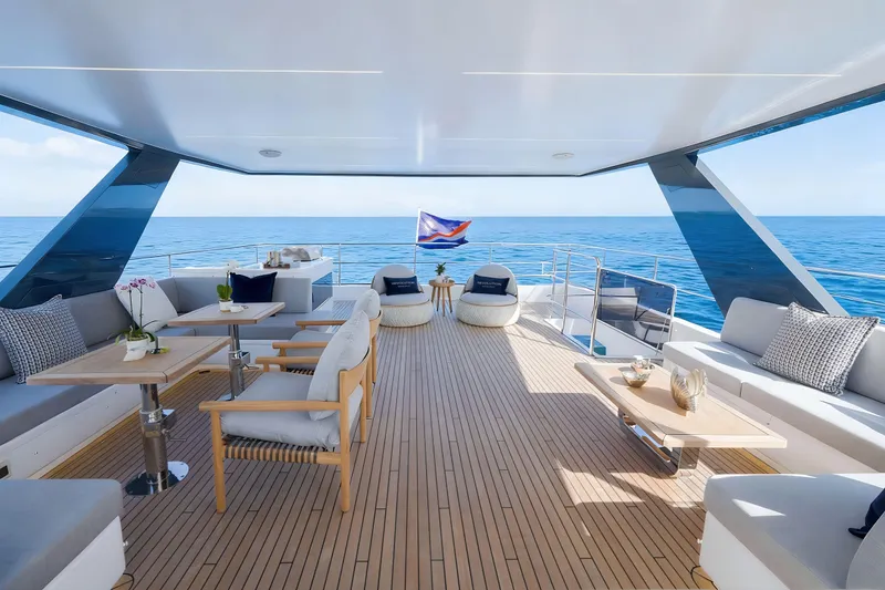 Slide: The Image of Luxurious Oceanwalker S60e electric yacht deck with elegant seating and ocean view, 2026 model. - 8