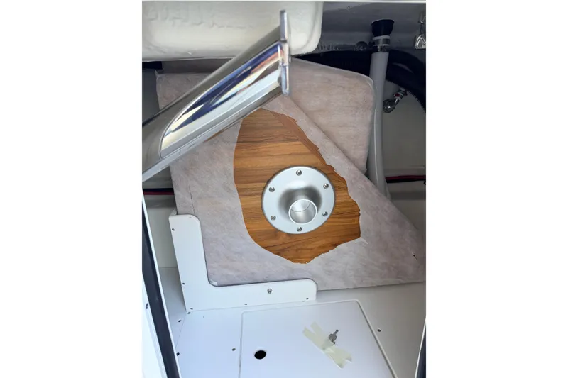 Slide: The Image of Interior view of 2026 Sea Ray SDX 230 boat, showcasing storage compartment details. - 11