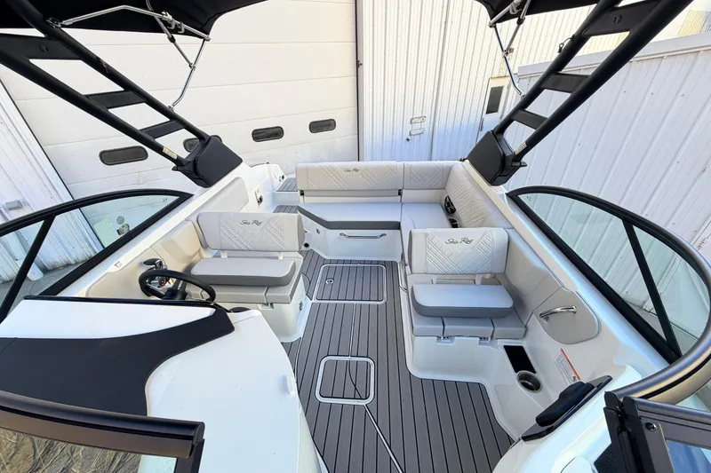 Slide: The Image of 2026 Sea Ray SDX 230 boat interior with sleek seating and modern design. - 12