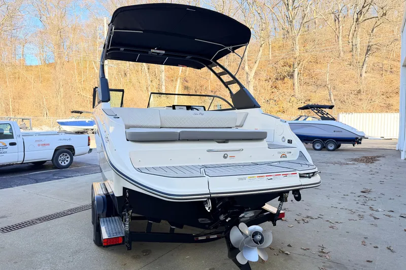 Slide: The Image of 2026 Sea Ray SDX 230 boat on trailer, rear view, outdoor setting. - 3