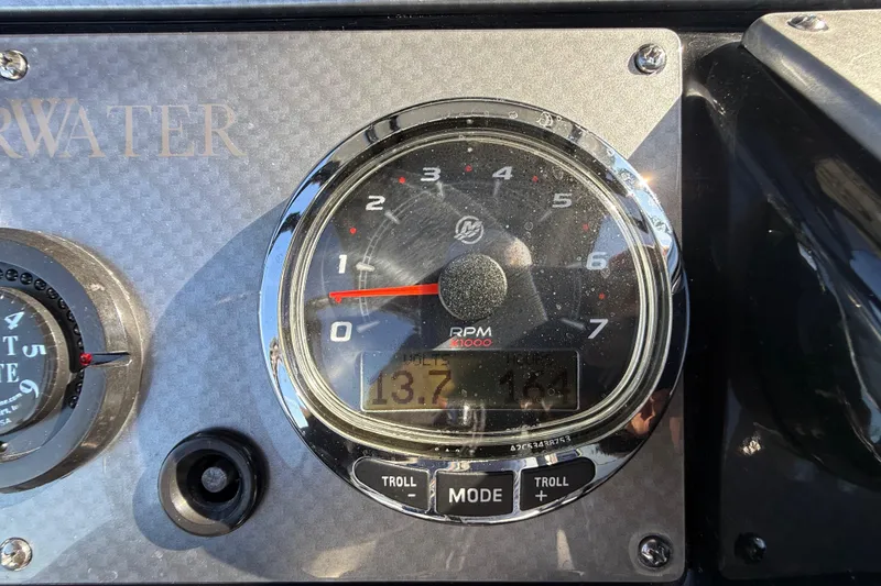 Slide: The Image of Close-up of 2018 ShearWater 23LTZ boat tachometer displaying RPM and digital readout. - 13