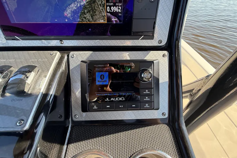 Slide: The Image of Control panel of a 2018 ShearWater 23LTZ boat with JL Audio system. - 16