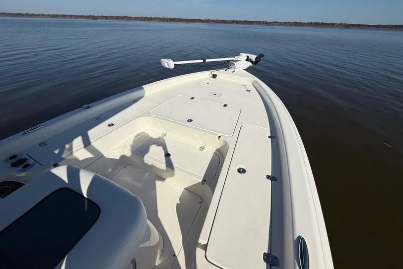 Slide: The Image of 2018 ShearWater 23LTZ boat on calm water, shadow of person taking photo. - 20