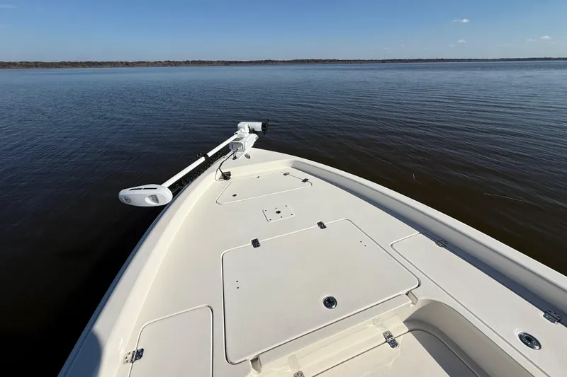 Slide: The Image of Bow view of 2018 ShearWater 23LTZ boat on calm water. - 21