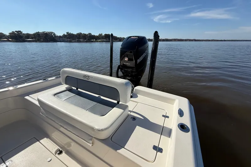 Slide: The Image of 2018 ShearWater 23LTZ boat with Mercury engine on calm lake. - 31
