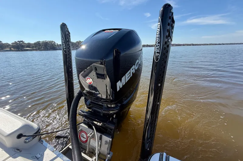 Slide: The Image of 2018 ShearWater 23LTZ boat with Mercury engine on a calm lake. - 32