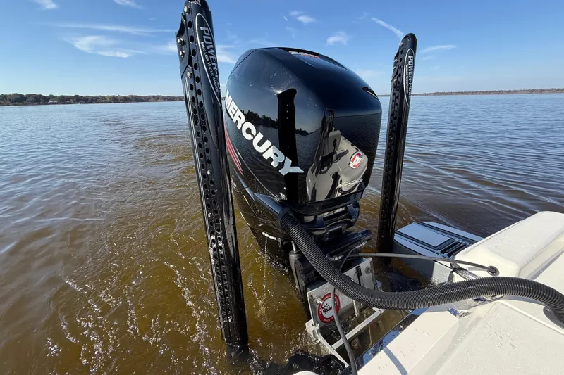 Slide: The Image of 2018 ShearWater 23LTZ boat with Mercury engine on a calm lake. - 34