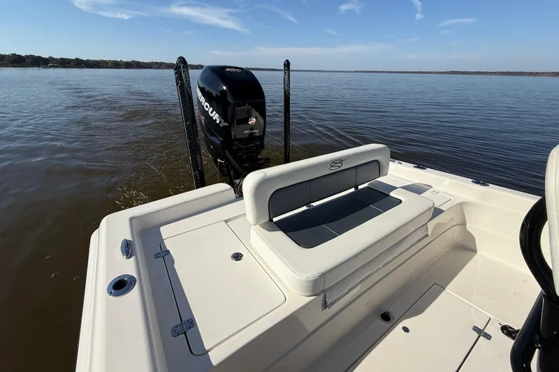 Slide: The Image of 2018 ShearWater 23LTZ boat with Mercury engine on calm water. - 35