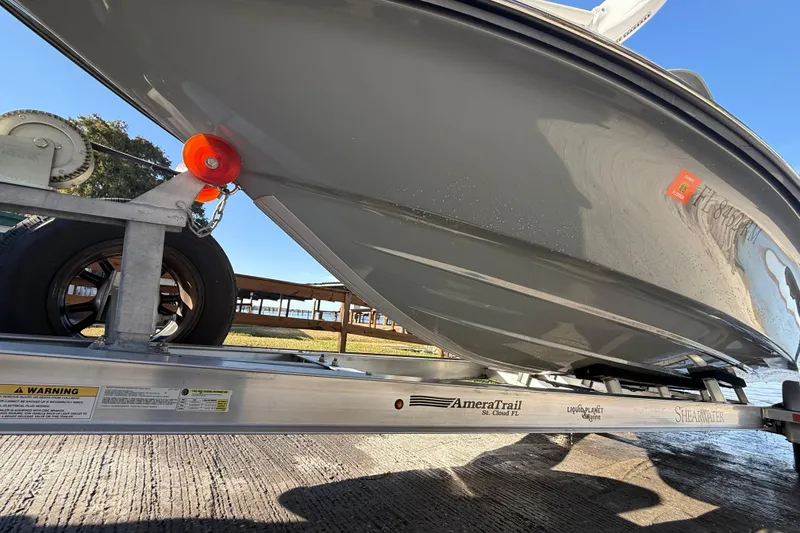 Slide: The Image of 2018 ShearWater 23LTZ boat on AmeraTrail trailer, close-up view. - 36