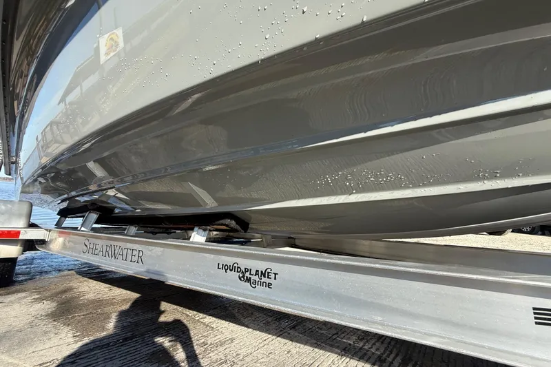 Slide: The Image of 2018 ShearWater 23LTZ boat on Liquid Planet Marine trailer, close-up view. - 40