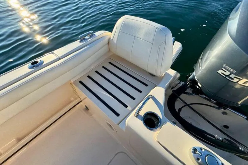 Slide: The Image of 2024 Grady-White Fisherman 216 boat interior with Yamaha 250 engine on water. - 11