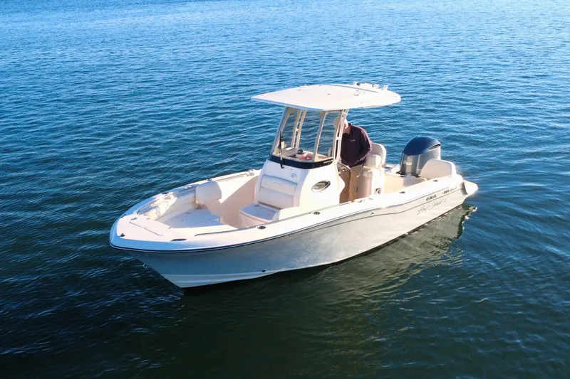 Slide: The Image of 2024 Grady-White Fisherman 216 boat on calm blue water. - 2