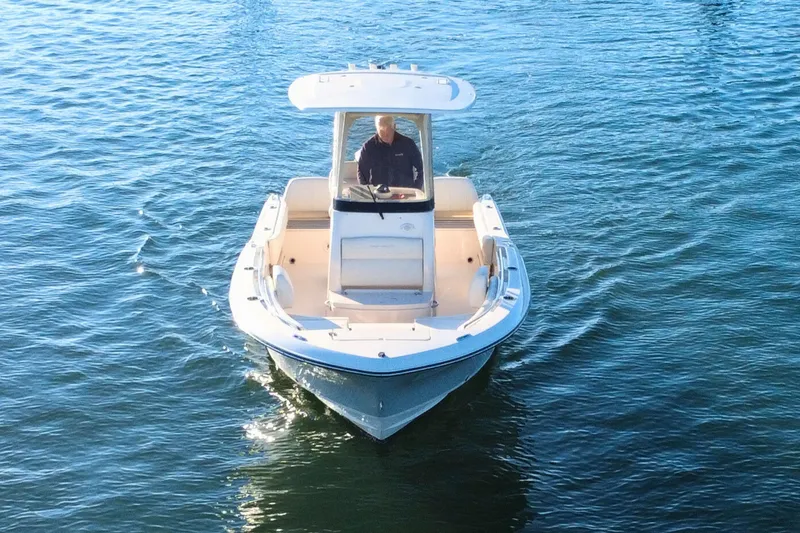 Slide: The Image of 2024 Grady-White Fisherman 216 boat cruising on open water. - 6