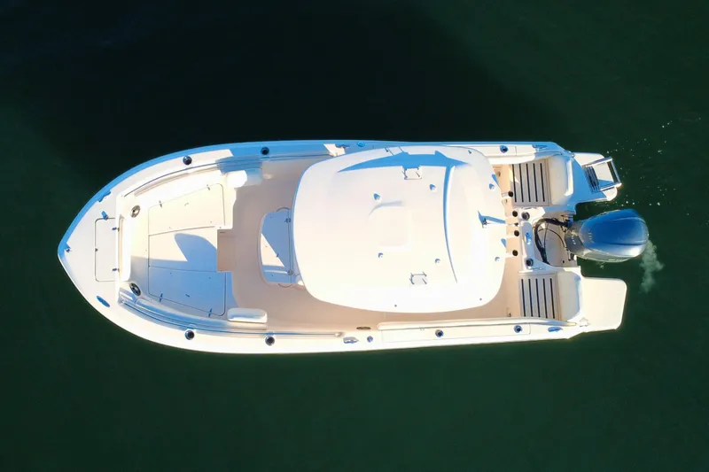 Slide: The Image of 2024 Grady-White Fisherman 216 boat, aerial view, on calm water. - 8