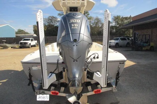 Slide: The Image of 2021 Skeeter SX240 boat with Yamaha 300 V6 engine, parked in a lot. - 4