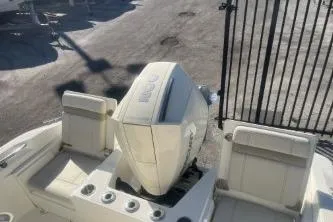 Slide: The Image of 2024 Boston Whaler 220 Dauntless boat with seating and engine view. - 11