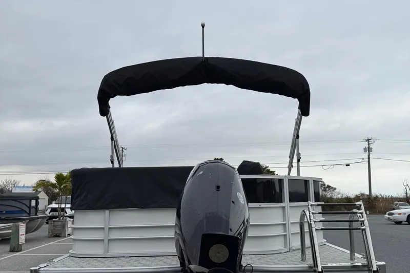 Slide: The Image of 2025 Berkshire 24CL 2.75 LE pontoon boat with canopy and outboard motor. - 4