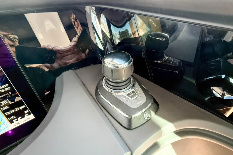 Slide: The Image of 2024 Axopar 45 XC Cross Cabin joystick control and dashboard display. - 16