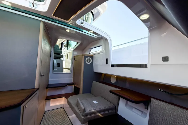 Slide: The Image of 2024 Axopar 45 XC Cross Cabin interior with modern seating and sleek design. - 32
