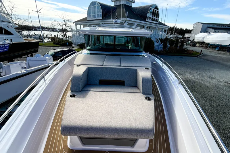 Slide: The Image of 2024 Axopar 45 XC Cross Cabin boat with sleek deck and modern seating. - 36