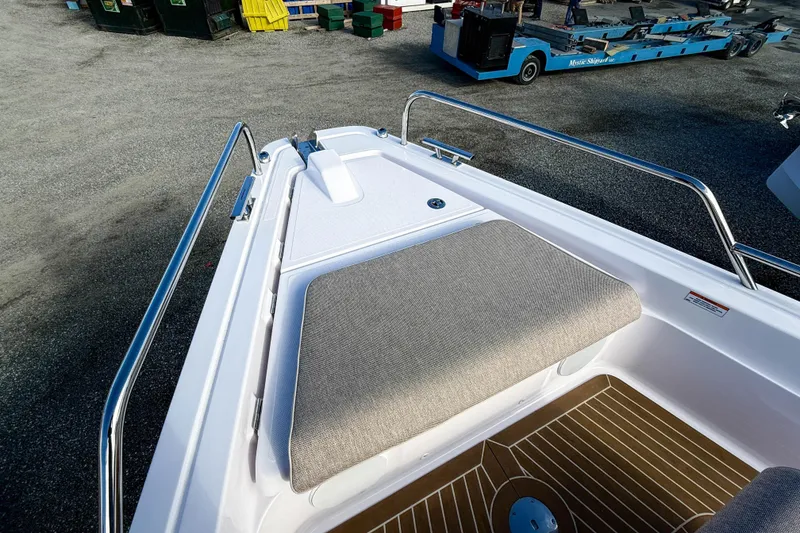 Slide: The Image of 2024 Axopar 45 XC Cross Cabin bow with cushioned seating and sleek design. - 37