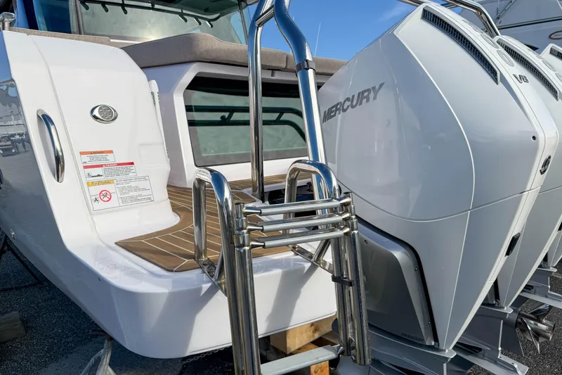 Slide: The Image of 2024 Axopar 45 XC Cross Cabin with Mercury outboard engines and stainless steel ladder. - 41
