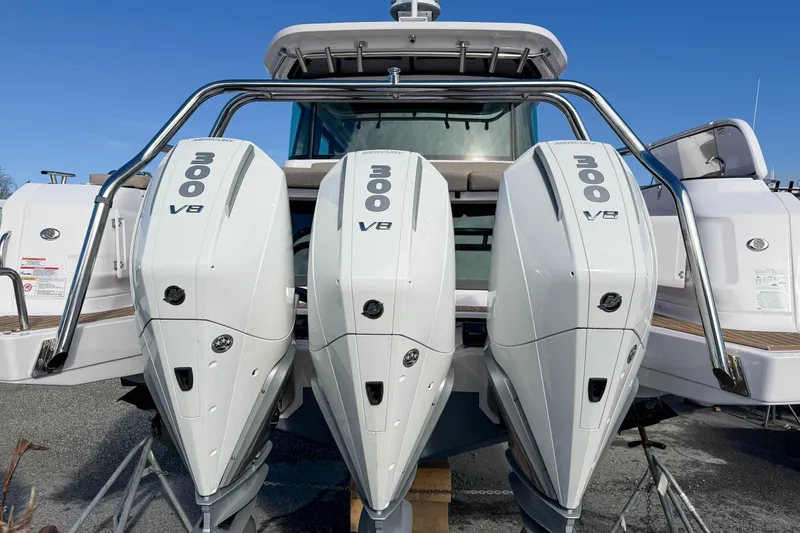 Slide: The Image of 2024 Axopar 45 XC Cross Cabin with triple 300 V8 engines, rear view. - 42