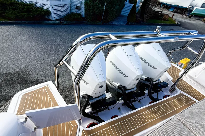 Slide: The Image of 2024 Axopar 45 XC Cross Cabin with triple Mercury outboard engines. - 43